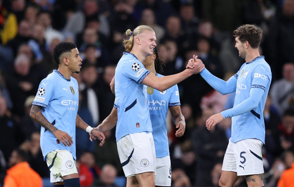 Erling Haaland of Manchester City celebrates with John Stones after scoring their fourth goal during the UEFA Champions League 2024/25 League Phase...