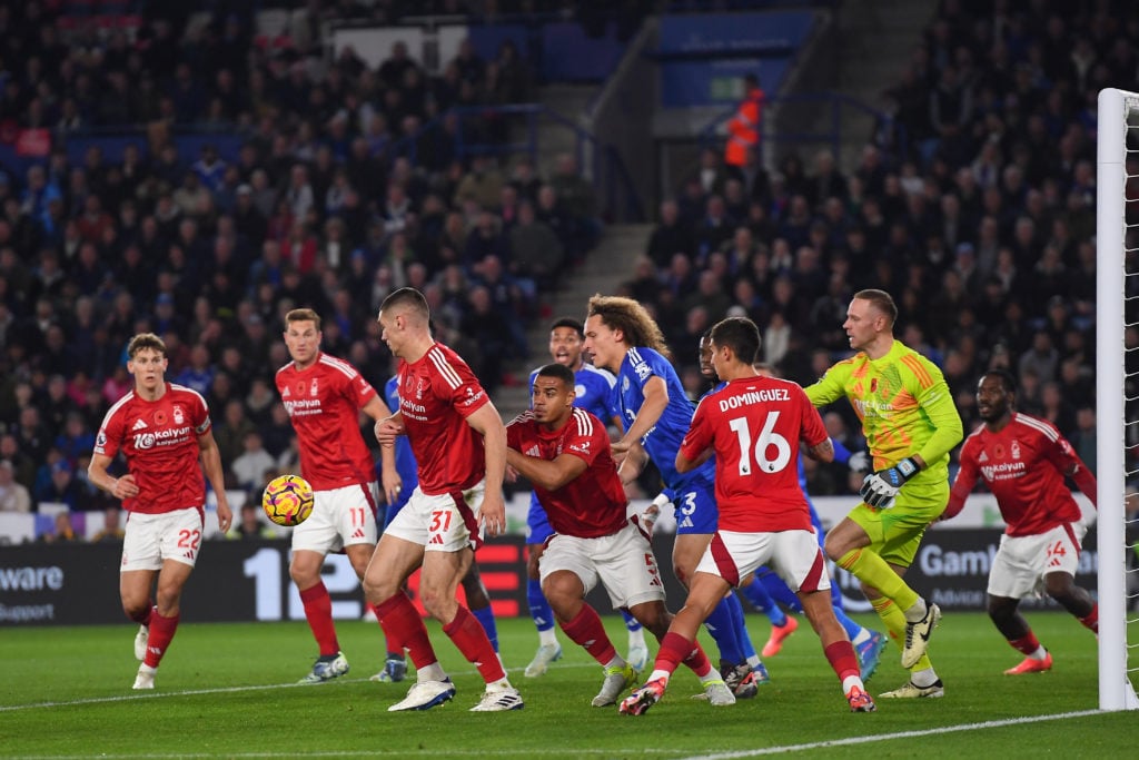 Nikola Milenkovic of Nottingham Forest shields the ball from Wout Faes of Leicester City during the Premier League match between Leicester City and...