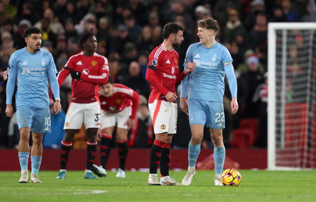 Bruno Fernandes of Manchester United clashes with Ryan Yates of Nottingham Forest during the Premier League match between Manchester United FC and ...