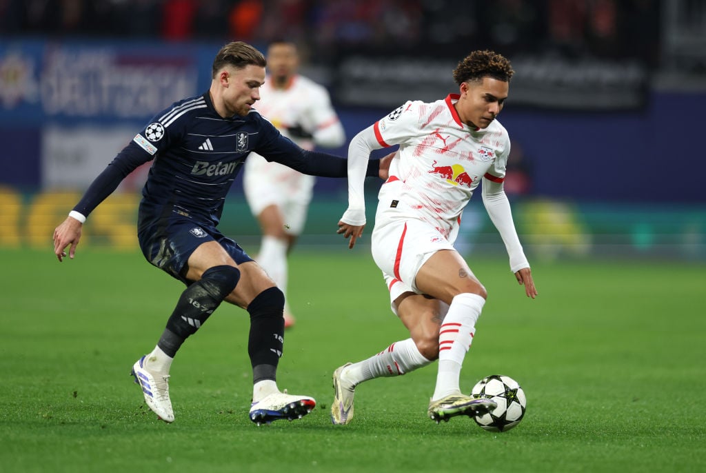 Antonio Nusa of RB Leipzig is challenged by Matty Cash of Aston Villa during the UEFA Champions League 2024/25 League Phase MD6 match between RB Le...