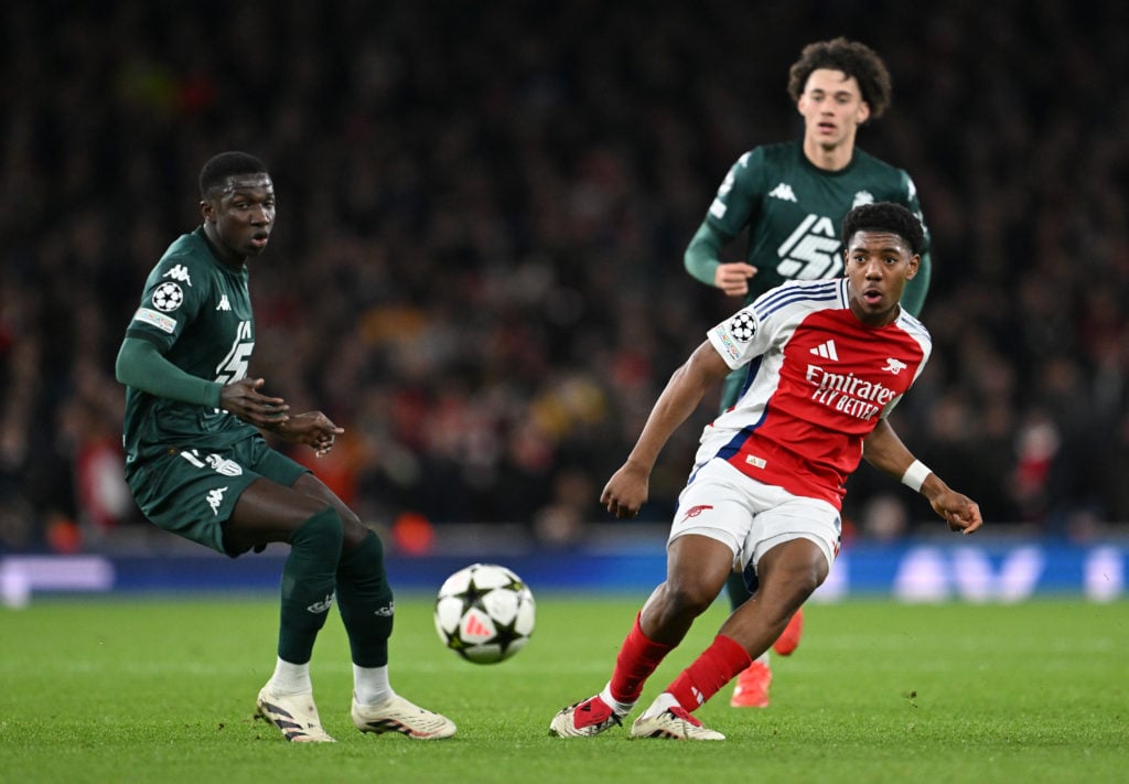 Myles Lewis-Skelly of Arsenal passes the ball whilst under pressure from Lamine Camara of AS Monaco during the UEFA Champions League 2024/25 League...