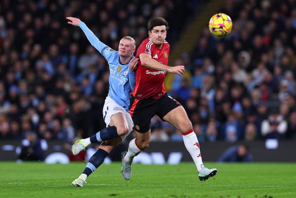 Erling Haaland of Manchester City and Harry Maguire of Manchester United during the Premier League match between Manchester City FC and Manchester ...