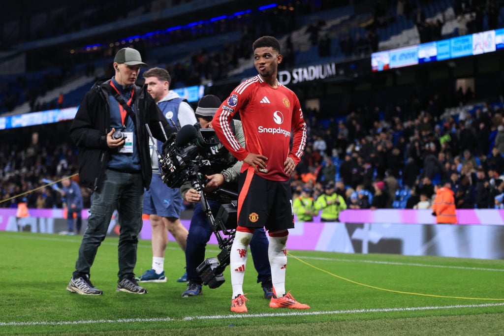 A Steadicam television (TV) cameraman films Amad Diallo of Manchester United as he looks on after the Premier League match between Manchester City ...