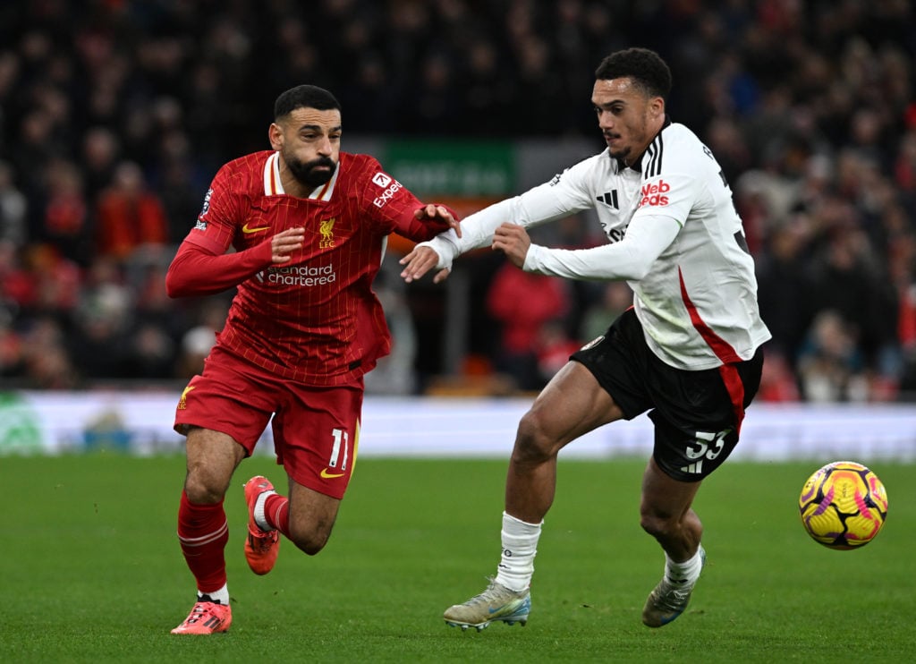 (SUN AND SUN ON SUNDAY OUT) Mohamed Salah of Liverpool battles for possession with Antonee Robinson of Fulham during the Premier League match betwe...