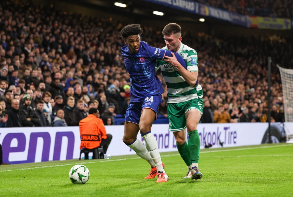 England , United Kingdom - 19 December 2024; Joshua Acheampong of Chelsea in action against Josh Honohan of Shamrock Rovers during the UEFA Confere...