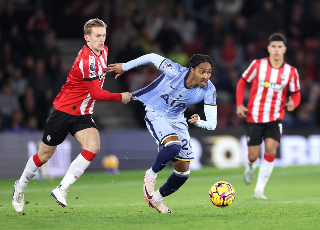 Djed Spence of Tottenham Hotspur runs with the ball whilst under pressure from Flynn Downes of Southampton during the Premier League match between ...