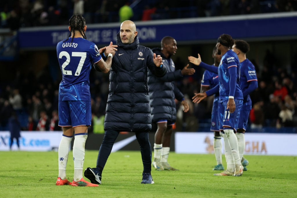 Malo Gusto and Enzo Maresca, Manager of Chelsea, celebrate after the team's victory during the Premier League match between Chelsea FC and Brentfor...