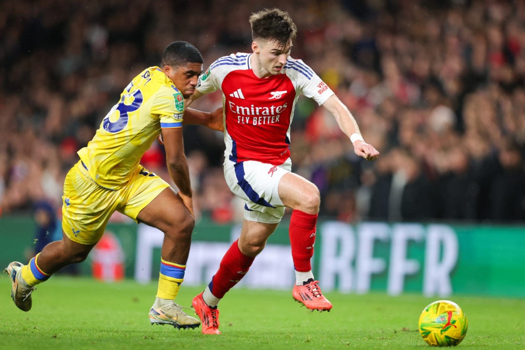 Kieran Tierney of Arsenal battles for possession with Caleb Kporha of Crystal Palace during the Carabao Cup Quarter Final match between Arsenal and...