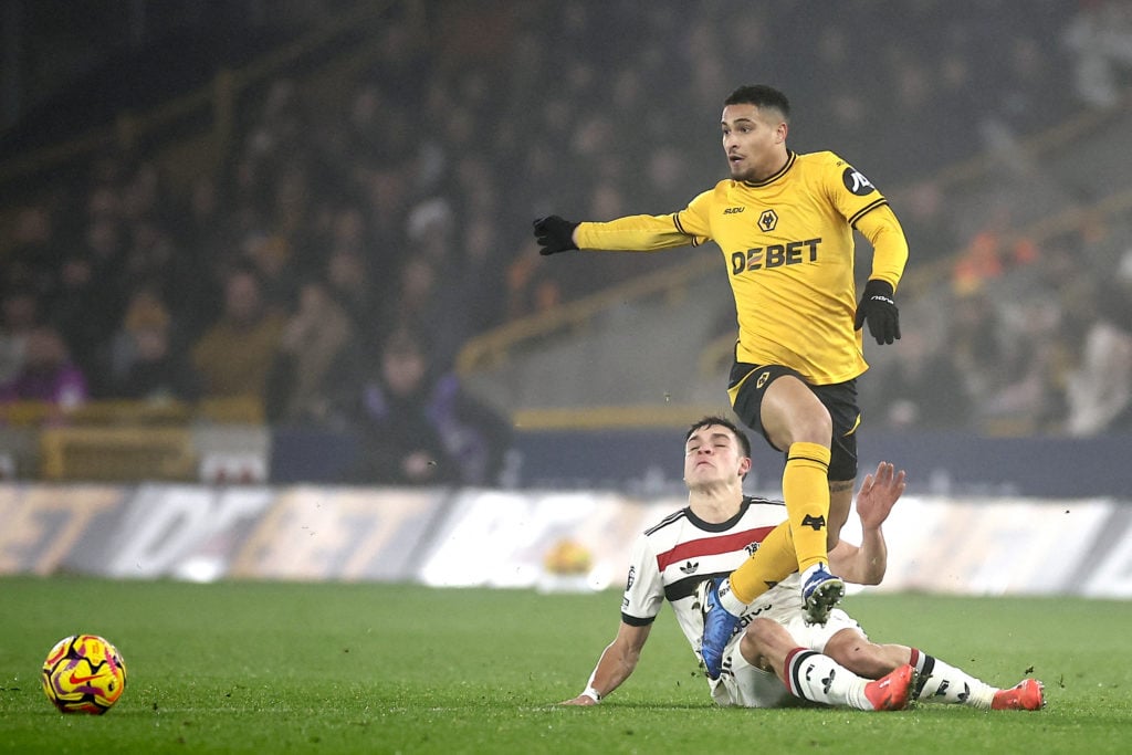 Manchester United's Uruguayan midfielder #25 Manuel Ugarte tackles Wolverhampton Wanderers' Brazilian midfielder #08 Joao Gomes during the English ...