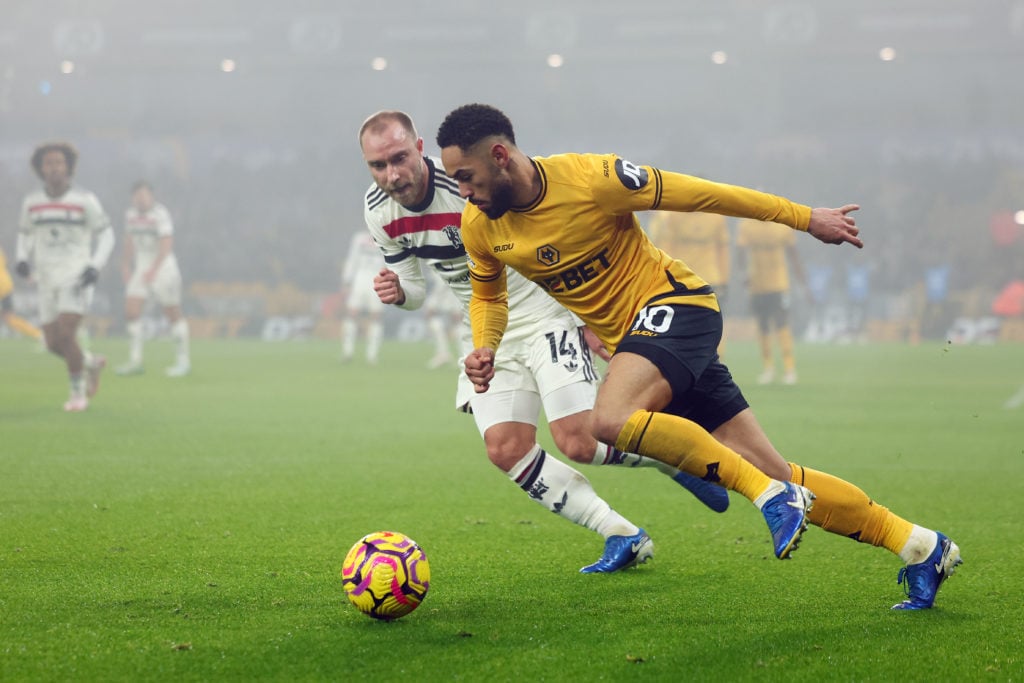 Matheus Cunha of Wolverhampton Wanderers is under pressure from Christian Eriksen of Manchester Utd during the Premier League match between Wolverh...