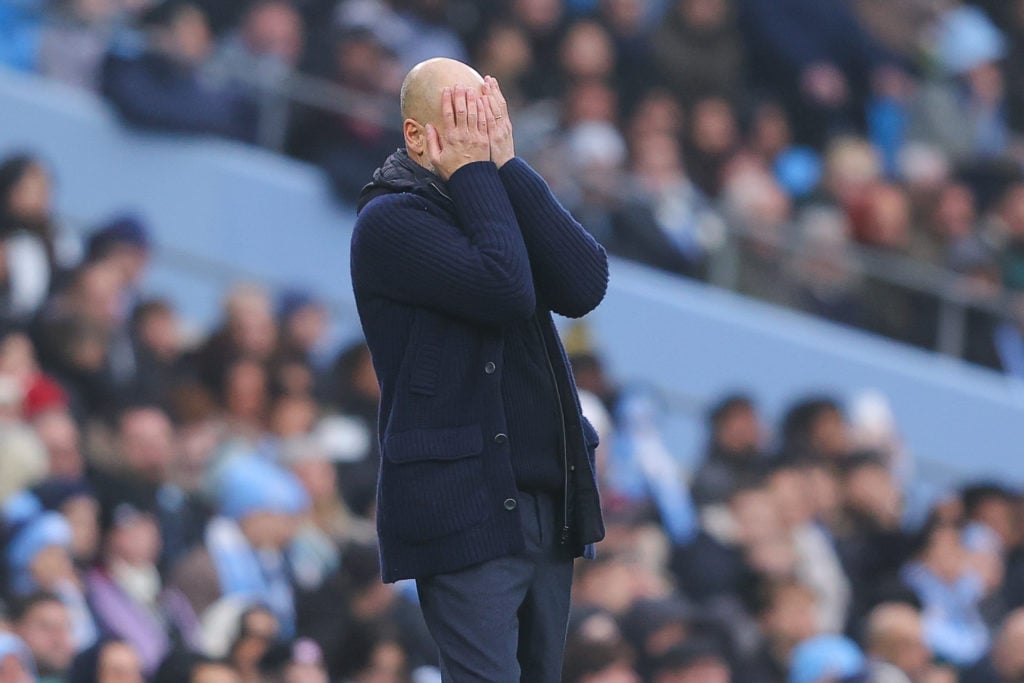 Josep 'Pep' Guardiola, manager of Manchester City, looks dejected during the Premier League match between Manchester City FC and Everton FC at Etih...