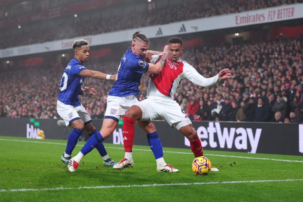 Kalvin Phillips and Omari Hutchinson of Ipswich Town tangle with Gabriel Magalhaes of Arsenal during the Premier League match between Arsenal FC an...