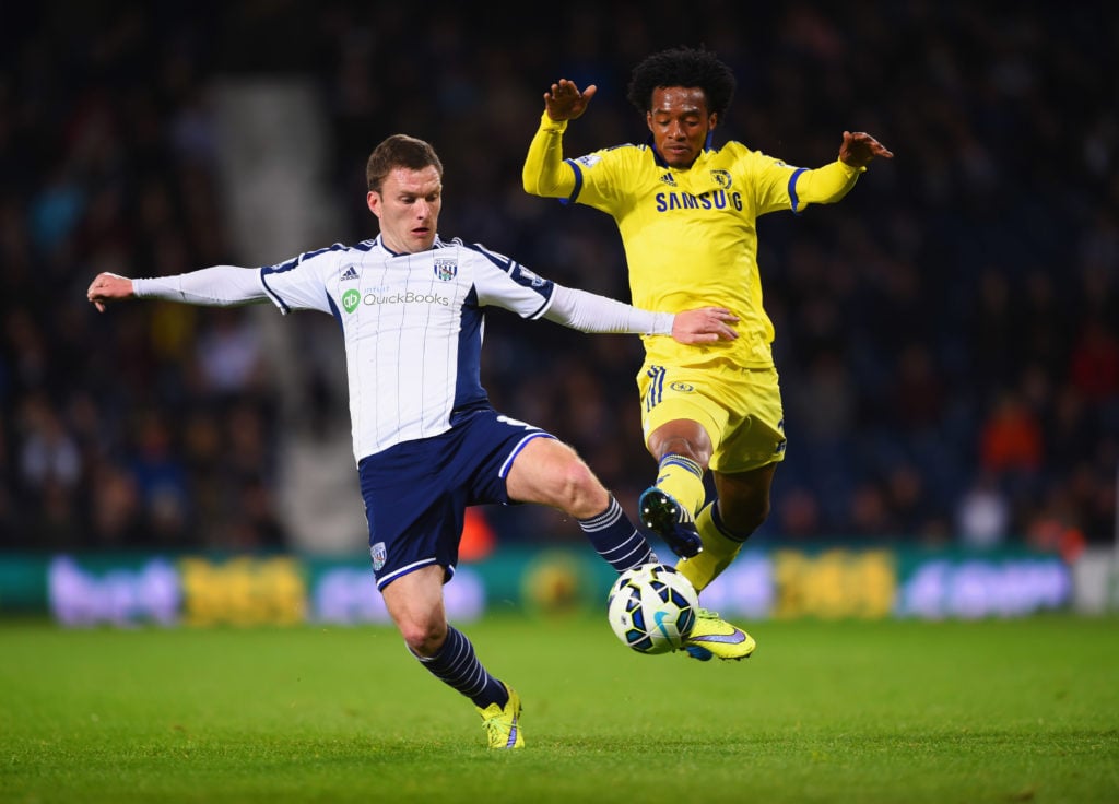 Craig Gardner of West Bromwich Albion and Juan Cuadrado of Chelsea battle for the ball during the Barclays Premier League match between West Bromwi...