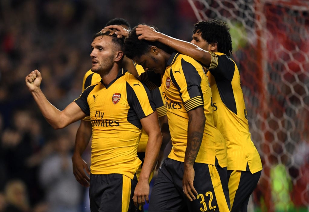 Lucas Perez (L) of Arsenal celebrates scoring his team's third goal during the EFL Cup Third Round match between Nottingham Forest and Arsenal at C...