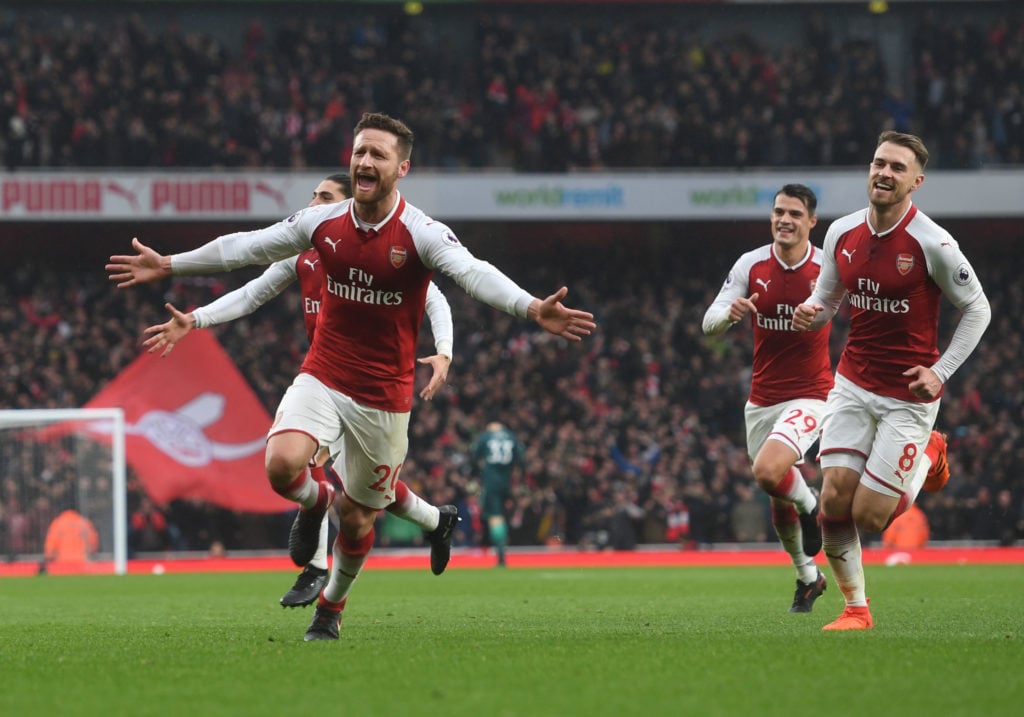 (L) Shkodran Mustafi celebrates scoring the first Arsenal goal with (R) Aaron Ramsey during the Premier League match between Arsenal and Tottenham ...