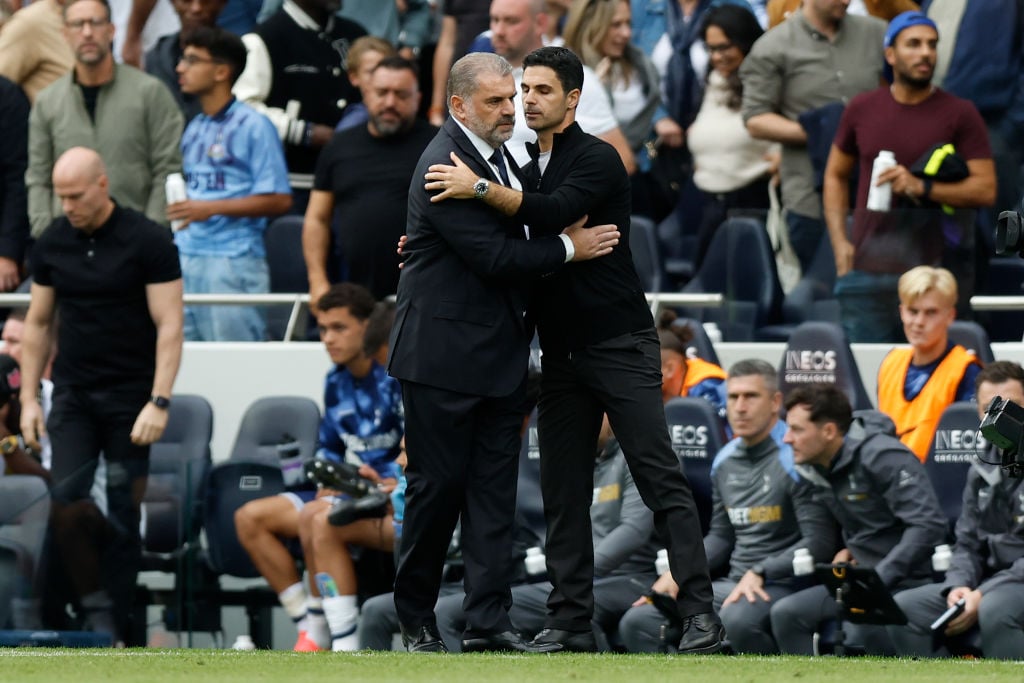 Ange Postecoglou, Manager of Tottenham Hotspur and Mikel Arteta, Manager of Arsenal hug on the side line after the Premier League match between Tot...