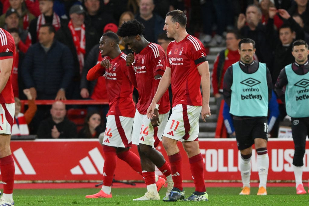 Goal scorers Callum Hudson-Odoi, Ola Aina, and Chris Wood of Nottingham Forest participate in the Premier League match between Nottingham Forest an...