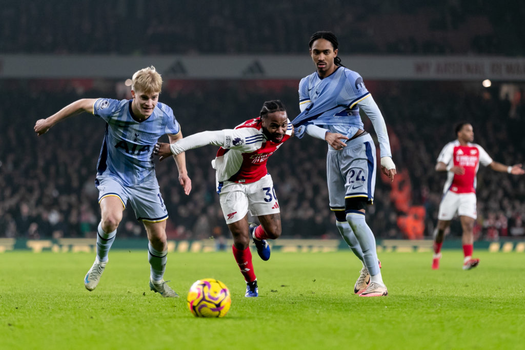 Raheem Sterling of Arsenal battle for the ball with Lucas Bergvall of Tottenham Hotspur and Djed Spence of Tottenham Hotspur during the Premier Lea...