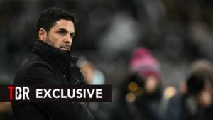 Mikel Arteta looks on, concerned.