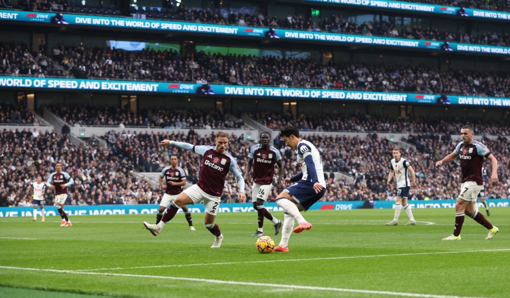 Tottenham Hotspur's Son Heung-Min takes on Aston Villa's Matty Cash during the Premier League match between Tottenham Hotspur FC and Aston Villa FC...