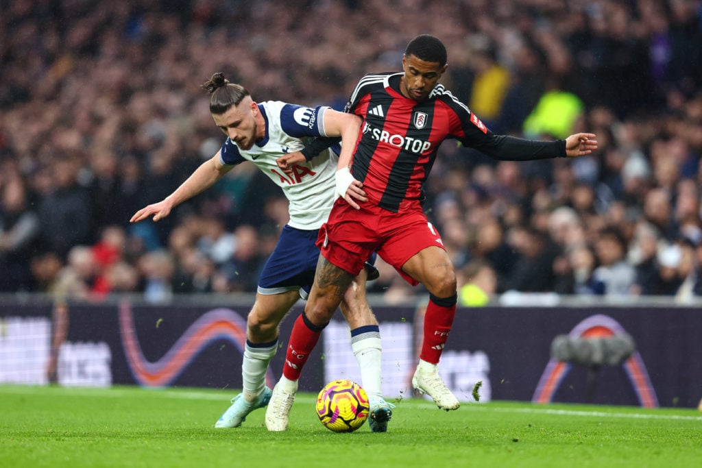 Radu Dragusin of Tottenham Hotspur and Reiss Nelson of Fulham during the Premier League match between Tottenham Hotspur FC and Fulham FC at Tottenham Hotspur Stadium on December 1, 2024