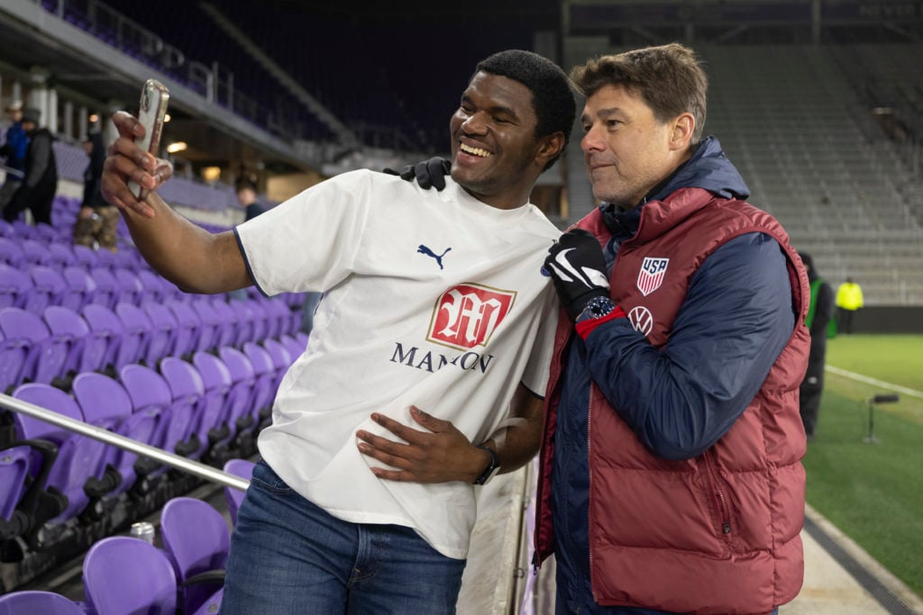 USMNT Head Coach Mauricio Pochettino takes photo with a fan at Inter&Co Stadium on January 22, 2025 in Orlando, Florida.