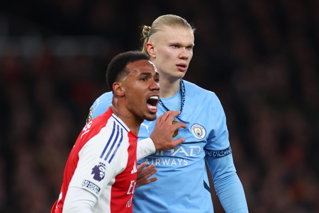 Gabriel Magalhaes of Arsenal tangles with Erling Haaland of Manchester City during the Premier League match between Arsenal FC and Manchester City FC at Emirates Stadium on February 2, 2025 in London, England.