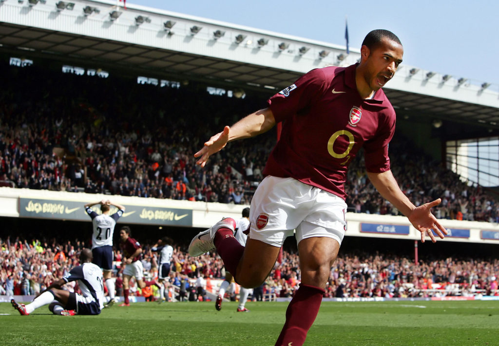 Arsenal's Thierry Henry (R) reacts after