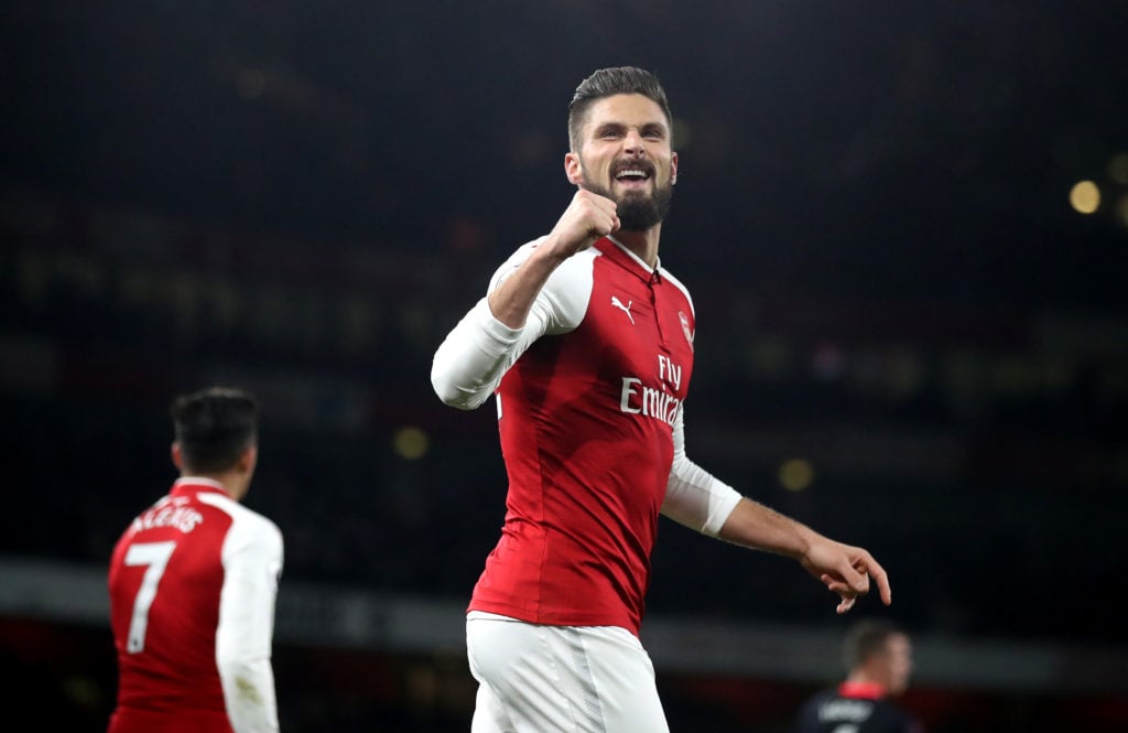 Olivier Giroud of Arsenal celebrates after scoring his sides second goal during the Premier League match between Arsenal and Huddersfield Town at E...