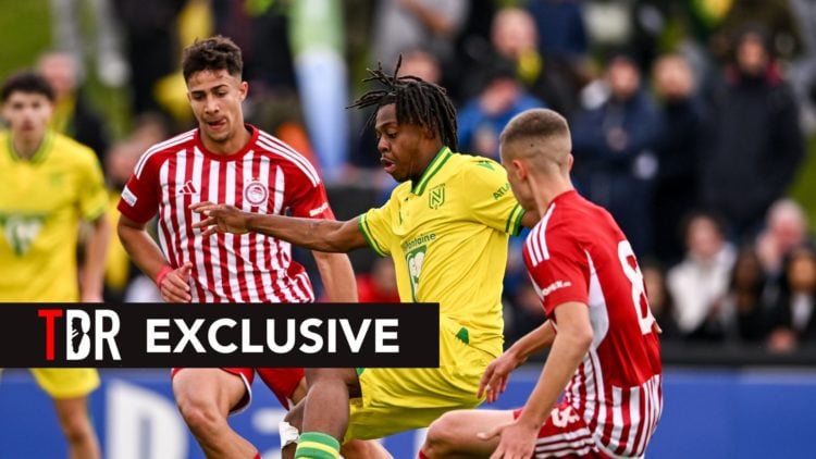 Brayan Nzita of FC Nantes is tackled by Charalampos Kostoulas, left, and Christos Mouzakitis of Olympiacos during the UEFA Youth League 2023/24 Sem...