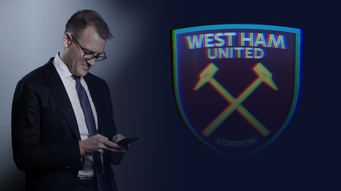 Daniel Kretinsky uses his mobile phone, with an image of the West Ham badge superimposed