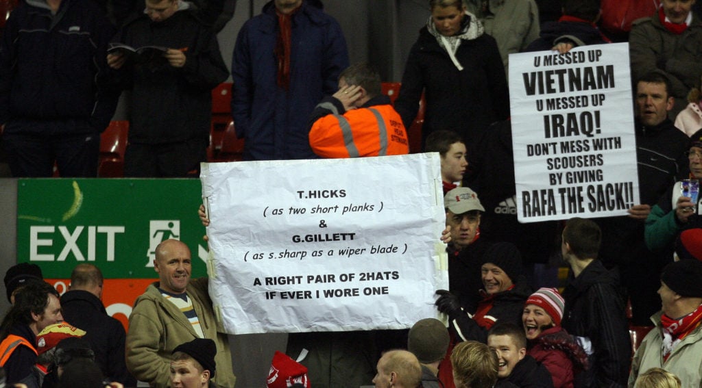 Liverpool football supporters hold banne