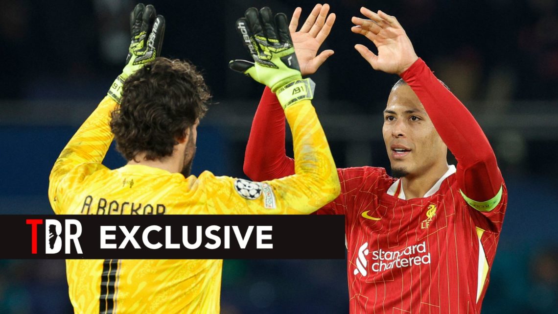 Liverpool's Dutch defender #04 Virgil van Dijk (R) and Brazilian goalkeeper #01 Alisson (L) celebrate Liverpool's victory over Paris Saint-Germain