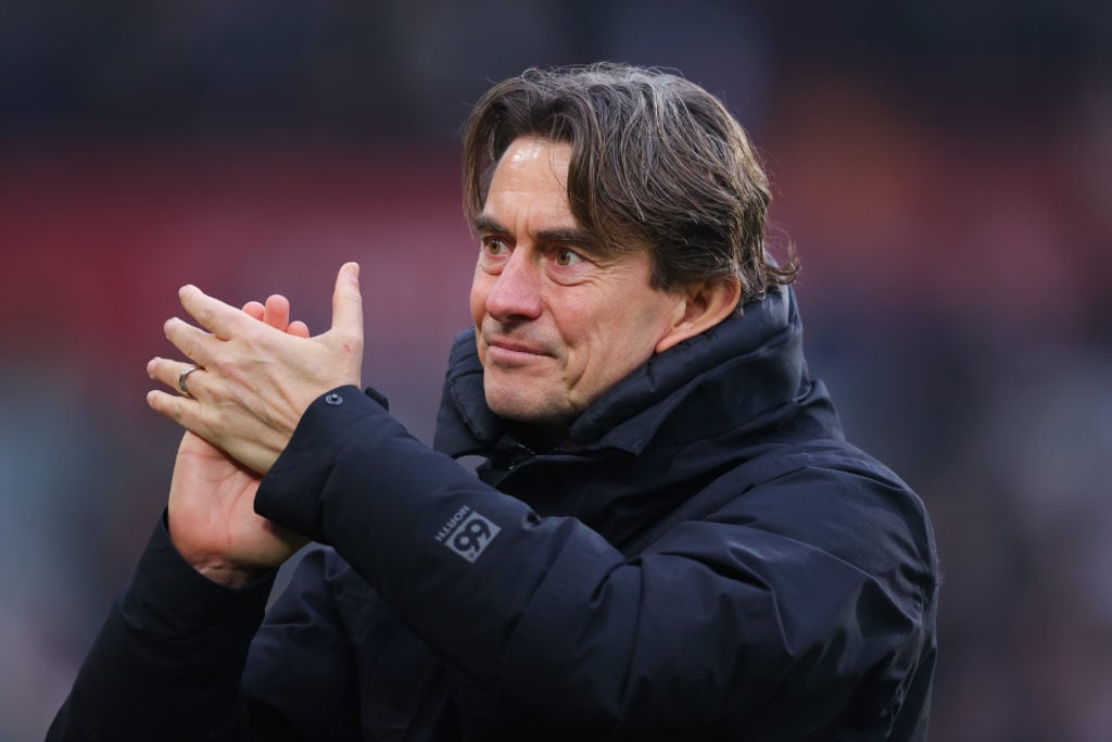 Former Brentford manager, now Tottenham head coach, Thomas Frank, applauding the fans after a game against Liverpool