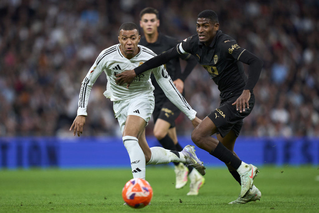 Valencia defender Cristhian Mosquera duels with Real Madrid's Kylian Mbappe.