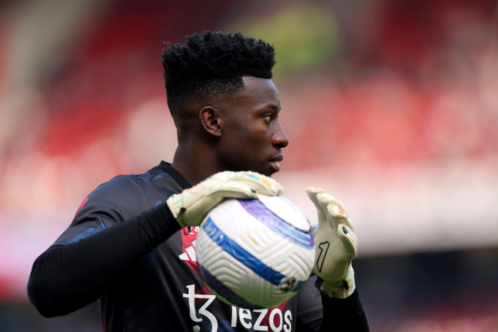 Andre Onana of Manchester United holds the ball during the warm up prior to the Premier League match between Manchester United FC and Wolverhampton Wanderers FC at Old Trafford on April 20, 2025