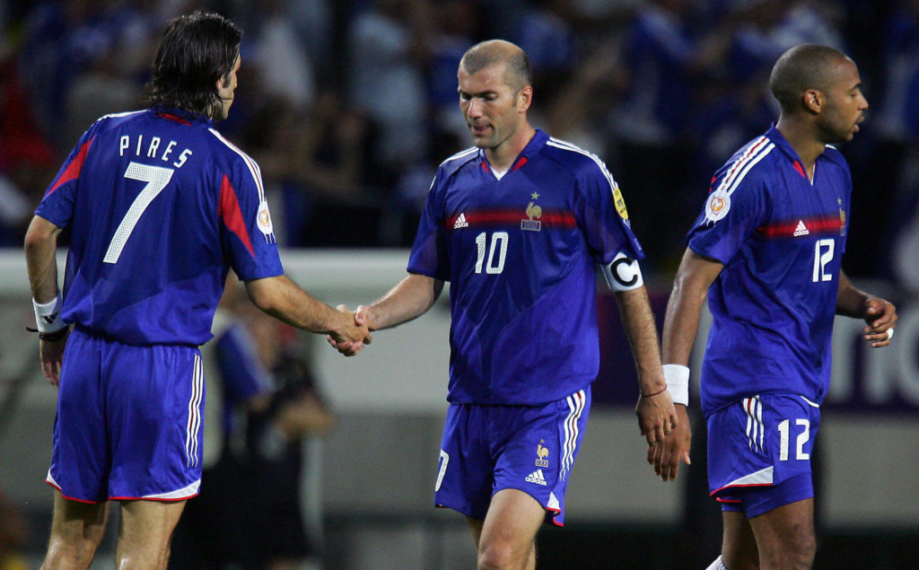 France's Robert Pires (L) shakes hands w