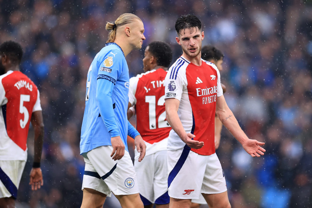 Declan Rice of Arsenal talks to Erling Haaland of Manchester City during the Premier League match between Manchester City FC and Arsenal FC at Etihad Stadium on September 22, 2024
