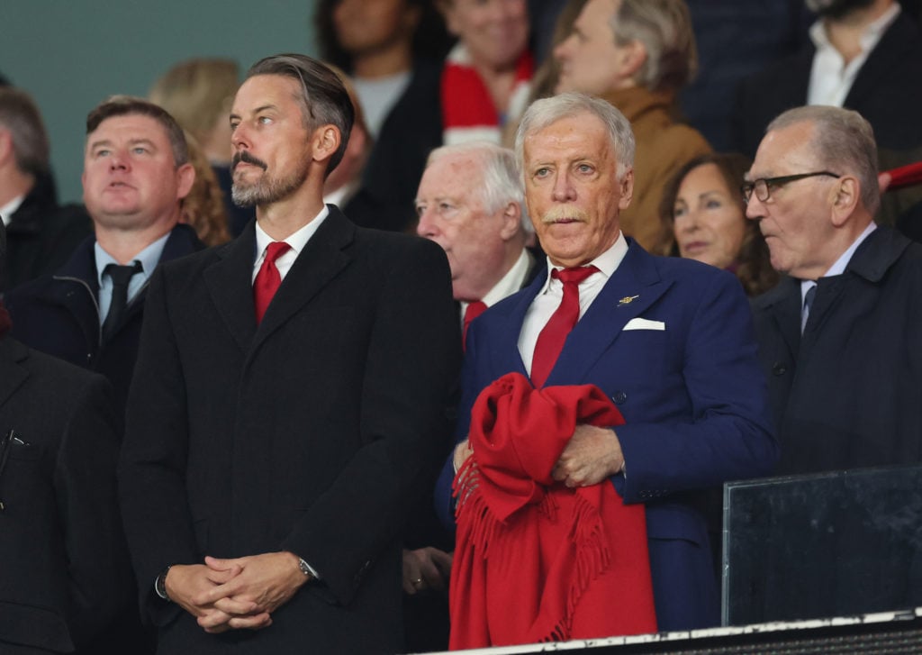 Stan Kroenke and Josh Kroenke watch from the stands as Arsenal face Paris Saint-Germain in the Champions League