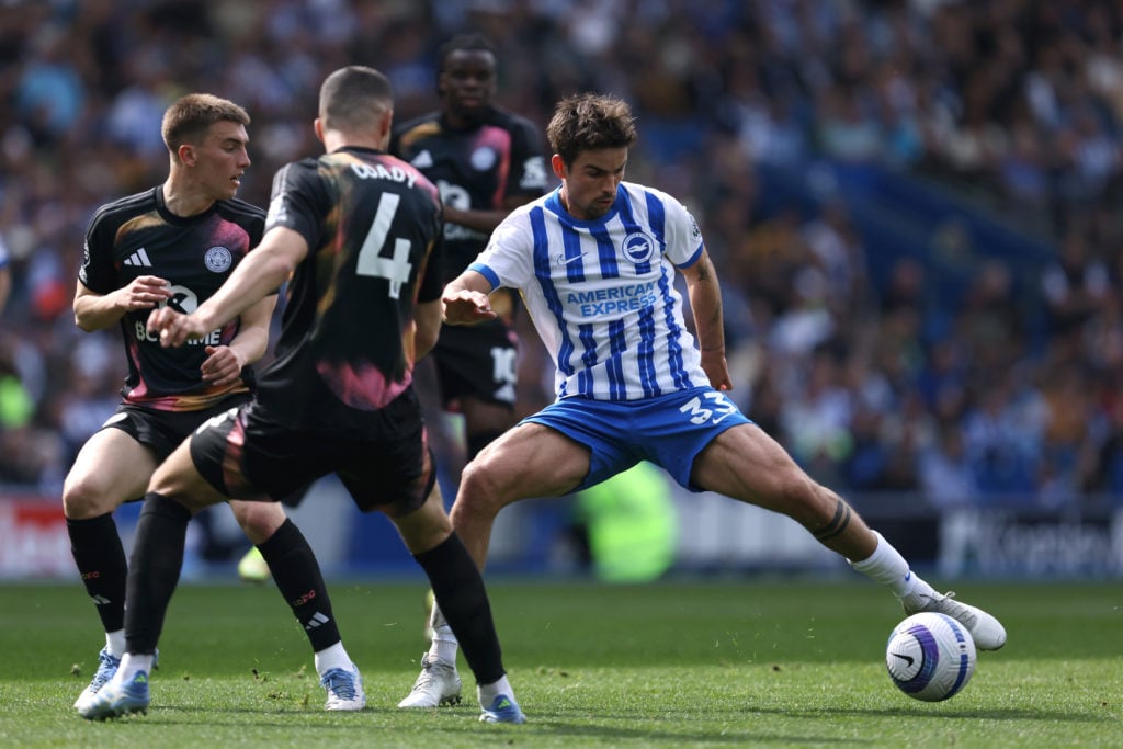 Matt O'Riley of Brighton and Hove Albion looks to bring the ball under control during the Premier League match between Brighton and Hove Albion FC and Leicester City FC at Amex Stadium on April 12, 2025 in Brighton, England.