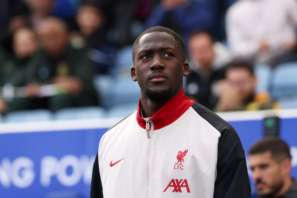 Ibrahima Konate looks on as Liverpool walk out to play a Premier League match.