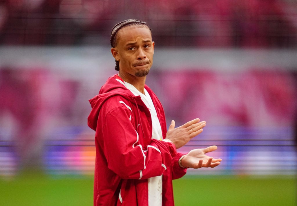 A dejected Xavi Simons applauds after RB Leipzig's defeat to Stuttgart.