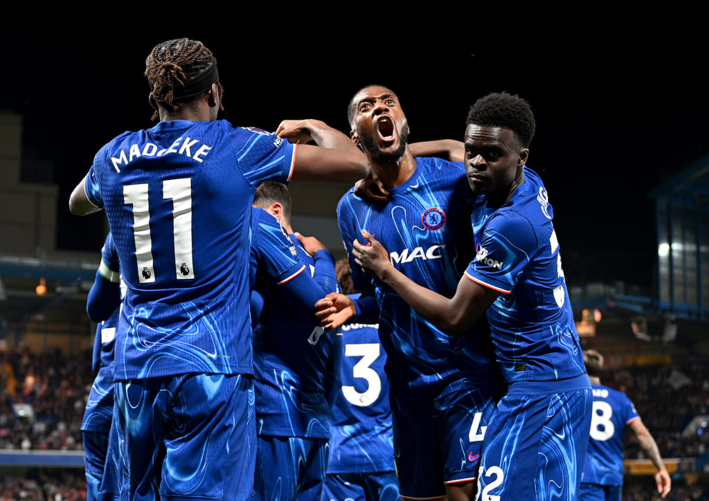 Chelsea players, including Tyrique George, celebrate goal against Manchester United.