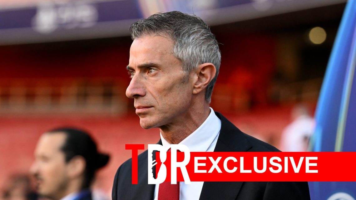 Image of Arsenal sporting director Andrea Berta before a game at the Emirates Stadium, overlaid a TBR Exclusive banner