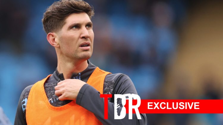 John Stones looks on for Man City.