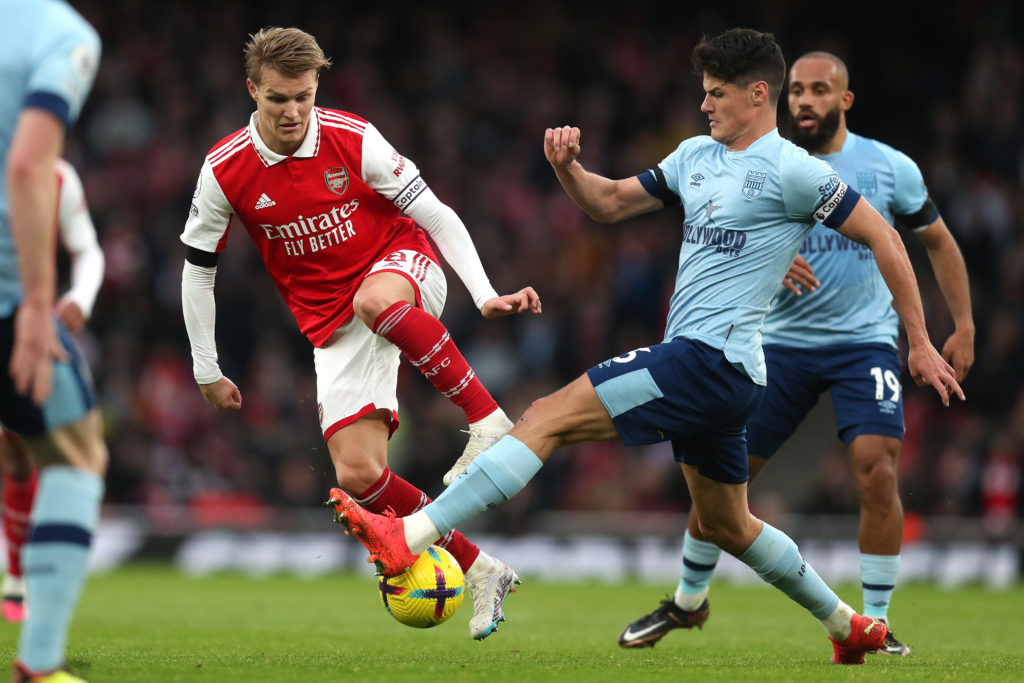 Christian Norgaard and Martin Odegaard duel for the ball during Arsenal vs Brentford.