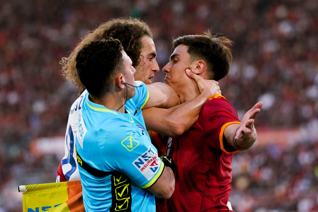 Paulo Dybala clashes with Matteo Guendouzi during a Serie A match.