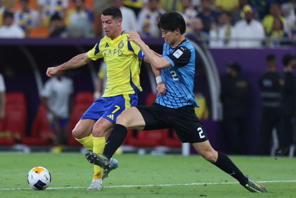 Tottenham target Kota Takai contests for the ball with Cristiano Ronaldo at the AFC Champions League.