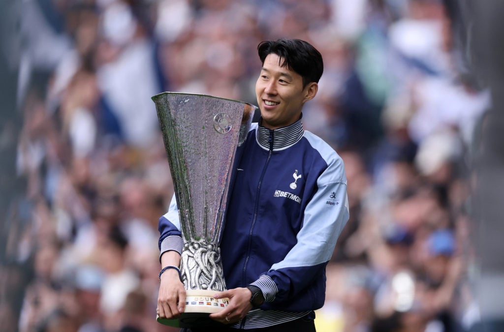 Heung-min Son posing with the Europa League trophy.