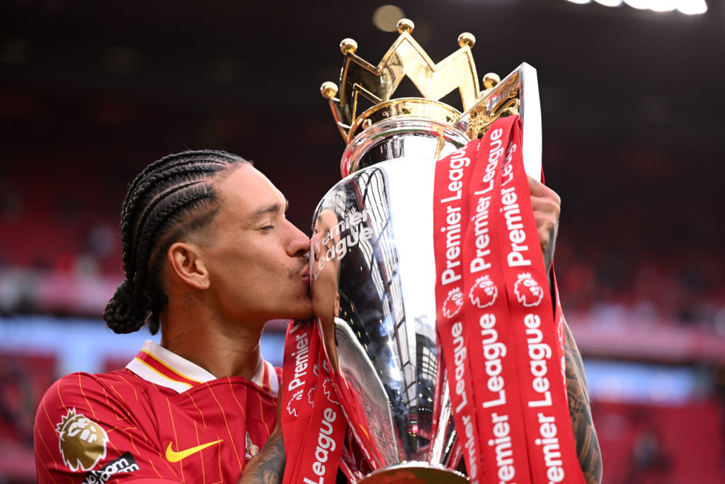 Darwin Nunez posing with the Premier League trophy after winning it with Liverpool.
